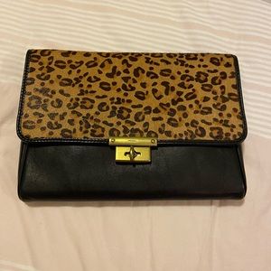 Leather leopard clutch with faux fur